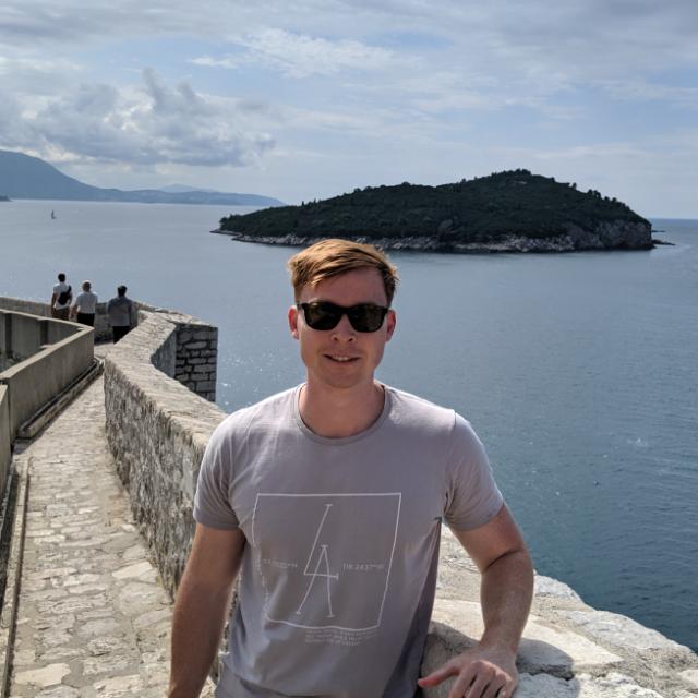 Image of Matthew Lockwood with the ocean behind him